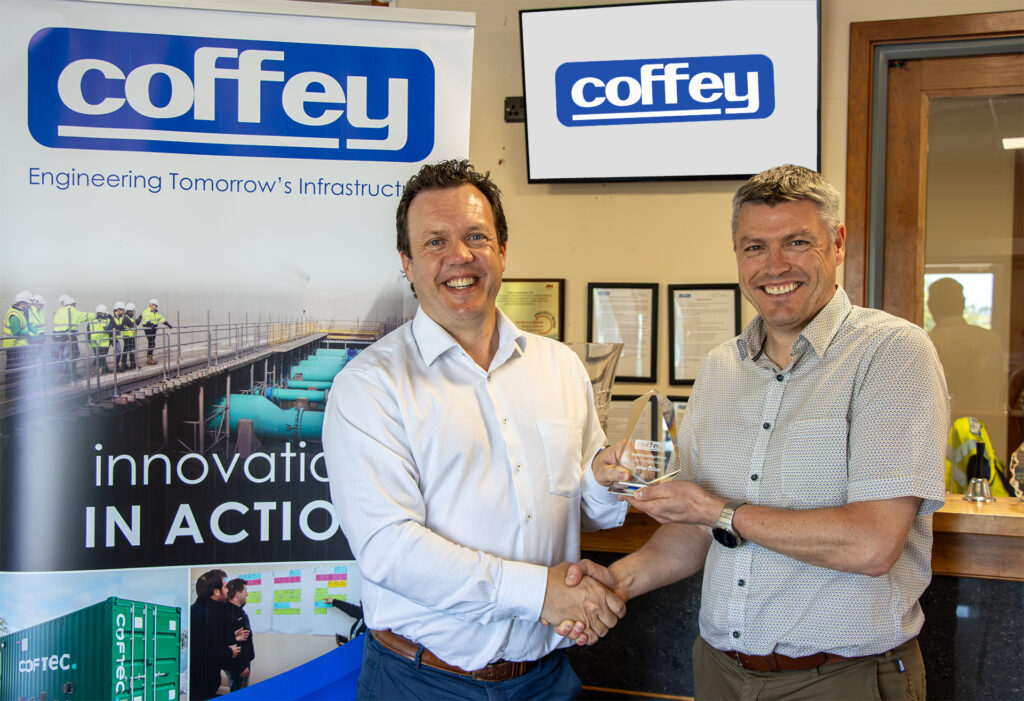 Coffey's Contacts manager, Allen Dolan, receiving the 'Do The Right Thing' Award