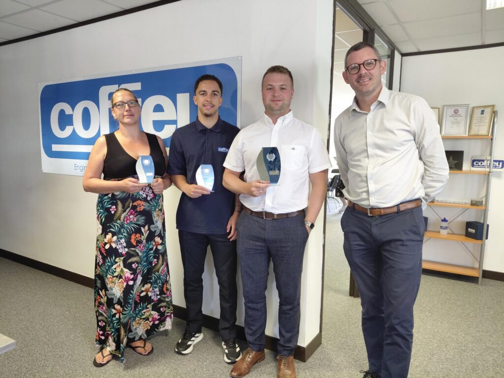 Winners of the Coffey Excellence Awards; Emma Buckley, Reece Peters and Harry Ferguson Walker with Coffey UK water director John Paul Smyth